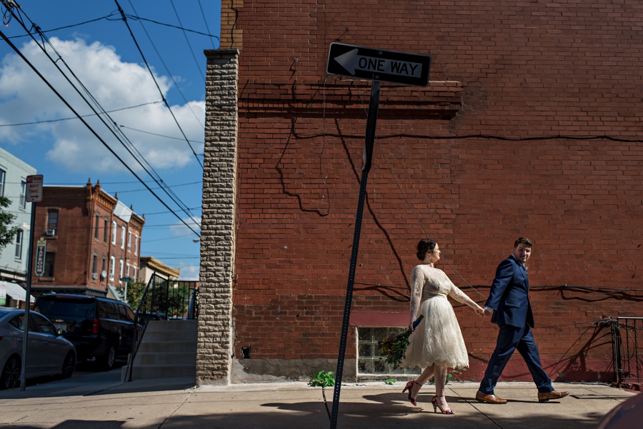 A newly married couple walk to their reception in South Philadelphia.